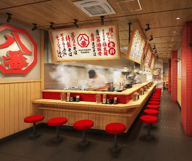 株式会社ハチバン公式発表掲載画像。金澤醤油豚骨8番らーめんのカウンター中心の店内イメージ。