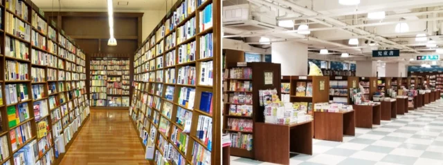 公式募集ページに掲載された三宮店の売場。本棚が並ぶ通路と、平積みの本があるフロア